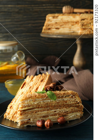 Concept of tasty dessert with honey cake, close up 92173320