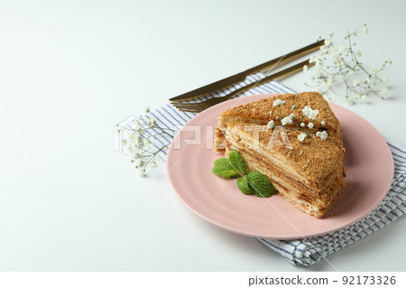 Concept of tasty dessert with honey cake, space for text Concept of tasty dessert with honey cake, space for text 92173326
