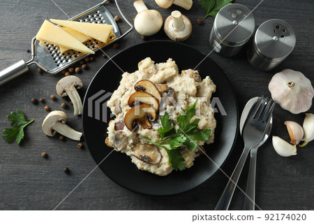 Concept of tasty food with risotto with mushrooms, top view Concept of tasty food with risotto with mushrooms, top view 92174020