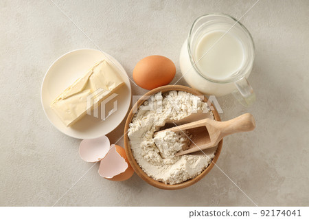 Ingredients for pie or cake cooking on light textured table Ingredients for pie or cake cooking on light textured table 92174041