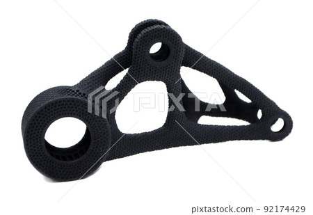Model printed on 3D printer isolated on white background. Object detail printed on 3D printer from black plastic close-up. Prototype of shape made by 3d printer. Concept new modern printing technology Model printed on 3D printer isolated on white background. Object detail printed on 3D printer from black plastic close-up. Prototype of shape made by 3d printer. Concept new modern printing technology 92174429
