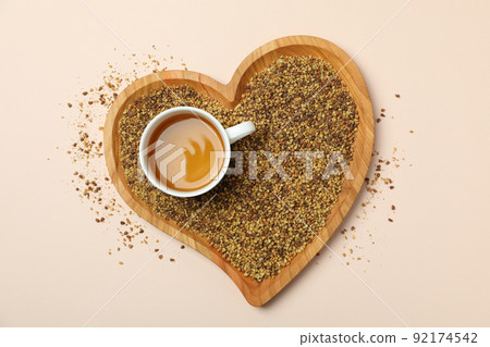 Concept of hot drink with buckwheat tea on beige background 92174542