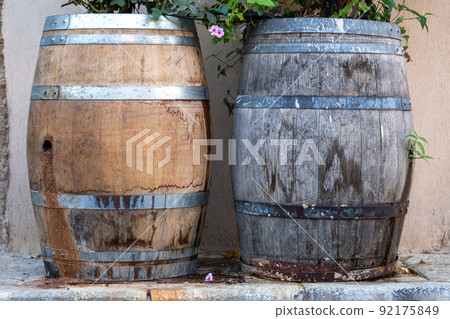 Wooden barrels with plants on the Tel Aviv street Wooden barrels with plants on the Tel Aviv street 92175849