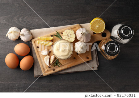 Concept of cooking garlic sauce on wooden background 92176031