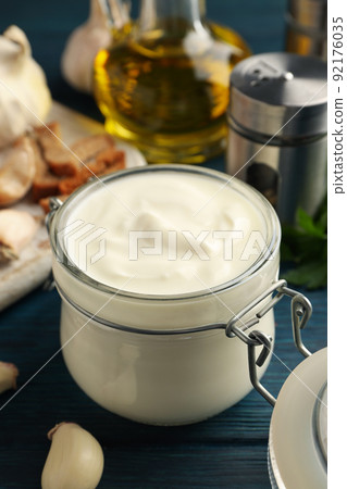 Concept of cooking garlic sauce on wooden background Concept of cooking garlic sauce on wooden background 92176035