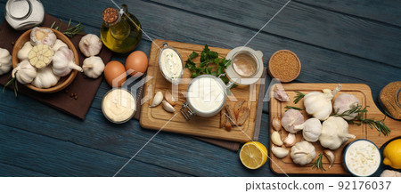 Concept of cooking garlic sauce on wooden background Concept of cooking garlic sauce on wooden background 92176037