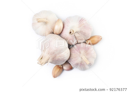 Garlic cloves and bulbs isolated on white background Garlic cloves and bulbs isolated on white background 92176377