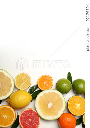 Different citrus fruits on white background, space for text 92176394