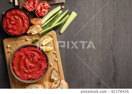 Concept of tasty food with hummus on dark wooden background Concept of tasty food with hummus on dark wooden background 92176426