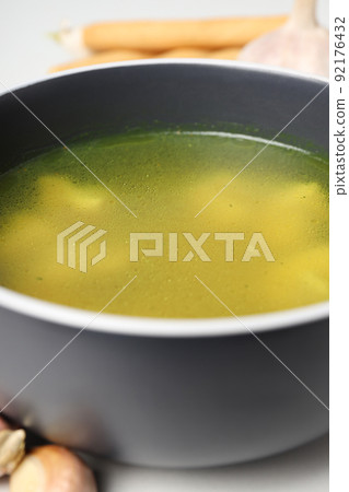 Concept of tasty food with chicken soup or broth, close up Concept of tasty food with chicken soup or broth, close up 92176432