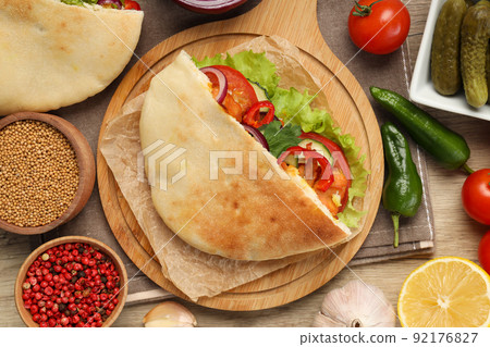 Concept of tasty food with pita with chicken, top view Concept of tasty food with pita with chicken, top view 92176827