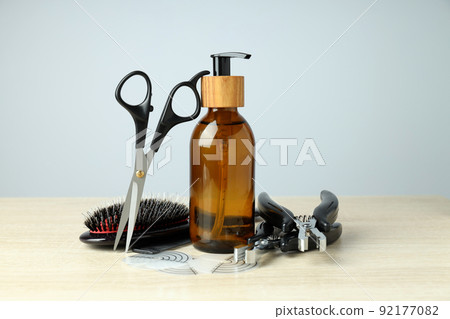 Composition with hair extension accessories on wooden table 92177082