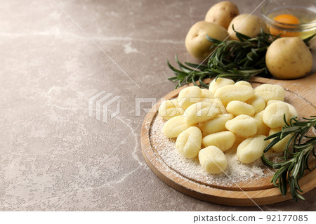 Concept of cooking potato gnocchi on gray textured background Concept of cooking potato gnocchi on gray textured background 92177085
