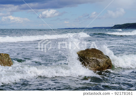 Rocks on the seashore. The sandy shore of the sea. Rocks on the seashore. The sandy shore of the sea. 92178161