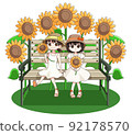 Two girls sitting on a bench in a sunflower field 92178570
