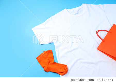 Blank t-shirt, bag and socks on blue background 92178774