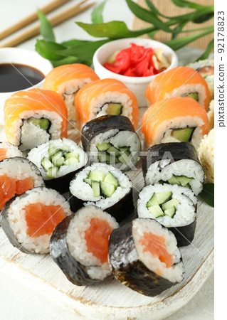 Concept of tasty food with sushi rolls, close up Concept of tasty food with sushi rolls, close up 92178823