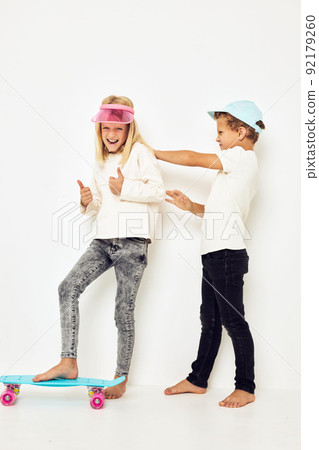 Stylish young friends posing games fun isolated background Stylish young friends posing games fun isolated background 92179260