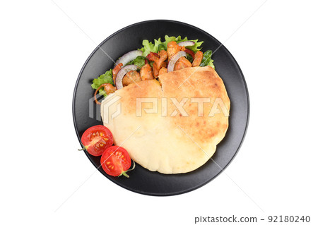 Plate with pita with chicken isolated on white background 92180240