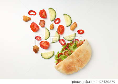 Pita with chicken, and ingredients on white background 92180879