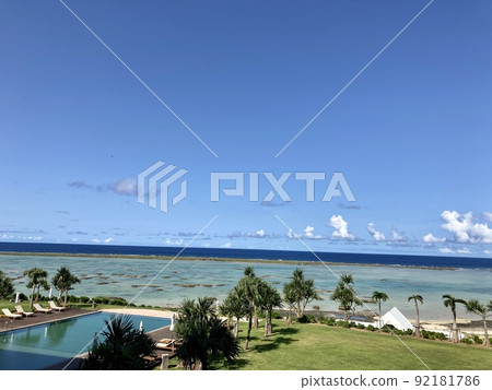 Infinity pool and sea seen from hotel room Infinity pool and sea seen from hotel room 92181786