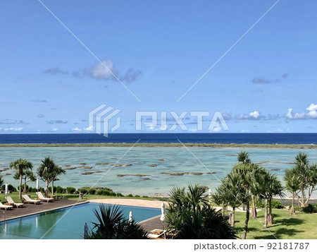 Infinity pool and sea seen from hotel room Infinity pool and sea seen from hotel room 92181787
