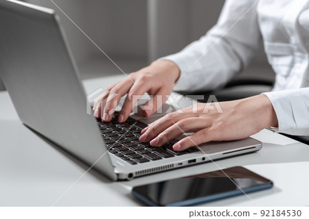 Businesswoman Typing Recent Updates On Lap Top Keyboard On Desk. Woman In Office Writing Important Message On Computer. Executive Inserting Crutial Data Into Pc. 92184530
