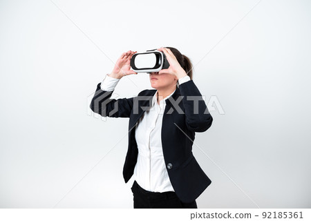 Standing Man Wearing Vr Glasses Presenting Important Messages. Businessman Having Virtual Reality Eyeglasses And Showing Crutial Informations. Female Seeing New Ideas. Standing Man Wearing Vr Glasses Presenting Important Messages. Businessman Having Virtual Reality Eyeglasses And Showing Crutial Informations. Female Seeing New Ideas. 92185361