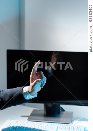 Businesswoman Pointing With One Finger On Important Messages. Executive In Suit Presenting Crutial Informations. Woman Showing Critical Announcements. Businesswoman Pointing With One Finger On Important Messages. Executive In Suit Presenting Crutial Informations. Woman Showing Critical Announcements. 92185492