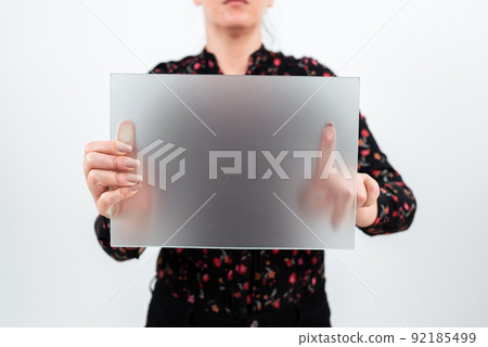 Businesswoman Holding Blank Placard And Making Important Announcement. Woman With Rectangular Board In Hands Presenting New Ideas For Advertising The Business. Businesswoman Holding Blank Placard And Making Important Announcement. Woman With Rectangular Board In Hands Presenting New Ideas For Advertising The Business. 92185499