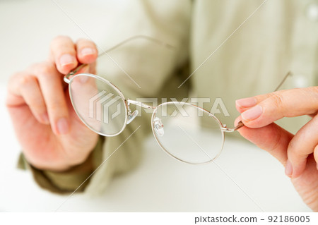 Middle woman with glasses (reading glasses) Middle woman with glasses (reading glasses) 92186005