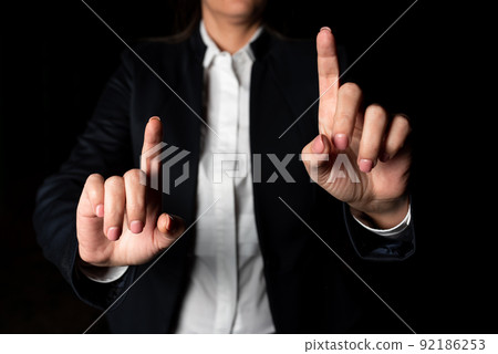 Businesswoman Pointing With Two Fingers On Important Messages. Executive In Suit Presenting Different Crutial Information. Woman Showing Critical Announcements. Businesswoman Pointing With Two Fingers On Important Messages. Executive In Suit Presenting Different Crutial Information. Woman Showing Critical Announcements. 92186253
