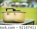 A pot heated on a barbecue stove 92187411