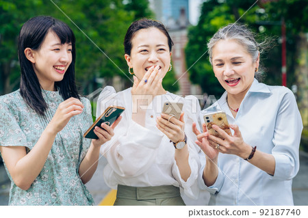 A woman with gray hair learning how to use a smartphone A woman with gray hair learning how to use a smartphone 92187740