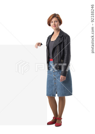 Woman holding large blank white sign 92188246