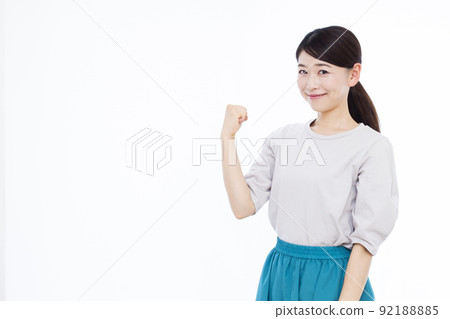 A woman in her thirties doing a guts pose A woman in her thirties doing a guts pose 92188885