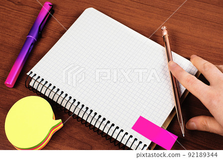 Man Showing Recent Informations On Notebook On Desk With Notes And Pencils. Businessman Presenting Important Message On Notepad On Table With Memos. Man Showing Recent Informations On Notebook On Desk With Notes And Pencils. Businessman Presenting Important Message On Notepad On Table With Memos. 92189344