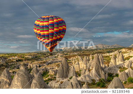 colorful hot air balloon flying over the goreme valley colorful hot air balloon flying over the goreme valley 92189346