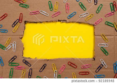 Important Informations Written Under Ripped Cardboard With Colored Paperclips Around. Crutial Announcements Underneath Torn Paperboard With Colorful Clips All Over. Important Informations Written Under Ripped Cardboard With Colored Paperclips Around. Crutial Announcements Underneath Torn Paperboard With Colorful Clips All Over. 92189348
