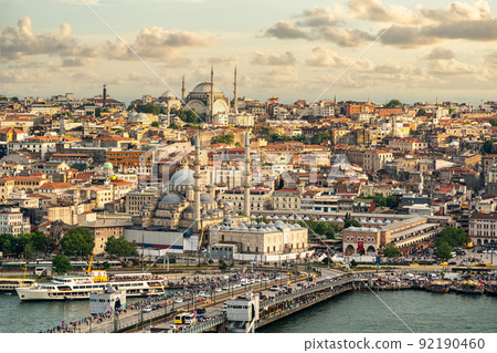 Istanbul skyline at sunset, Turkey. Aerial panoramic view of Galata bridge, Golden Horn and old Fatih district Istanbul skyline at sunset, Turkey. Aerial panoramic view of Galata bridge, Golden Horn and old Fatih district 92190460