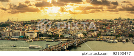Istanbul skyline at sunset, Turkey. Panoramic view of Galata bridge, Golden Horn and old Fatih district 92190477