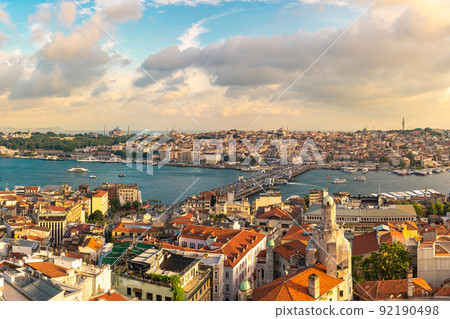 Istanbul skyline at sunset, Turkey. Panoramic view of Galata bridge, Golden Horn and old Fatih district 92190498