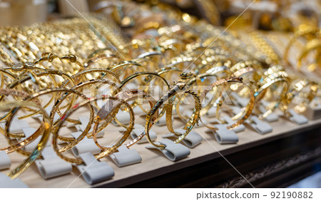 A lot of gold jewelry on a shop window in Turkey 92190882