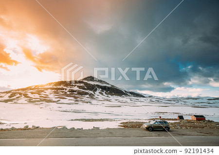 Aurlandsfjellet, Norway. Car SUV Parked Near Aurlandsfjellet Scenic Route Road In Summer Norwegian Landscape. Natural Norwegian Landmark And Popular Destination 92191434