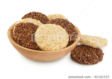 coconut and amaranth cookies with carob in wooden bowl isolated on white background with full depth of field. Healthy food. 92191537