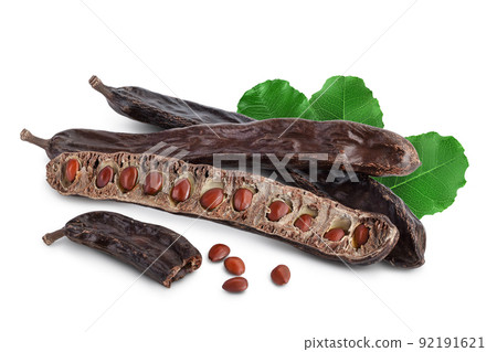 Ripe carob pods and bean isolated on white background with full depth of field Ripe carob pods and bean isolated on white background with full depth of field 92191621