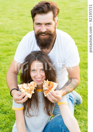 having fun. happy couple eating pizza. Healthy food. 92195551