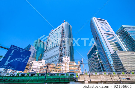View of Shiodome offices and Yamanote line from the intersection of Higashi-Shimbashi 1-chome, Tokyo cityscape of Japan = July 1st 92196665