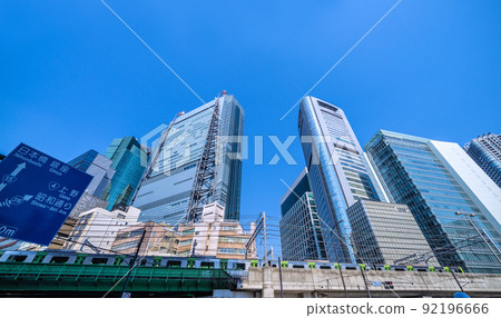 View of Shiodome offices and Yamanote line from the intersection of Higashi-Shimbashi 1-chome, Tokyo cityscape of Japan = July 1st 92196666