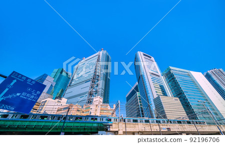 View of Shiodome offices and trains from the intersection of Higashi-Shimbashi 1-chome, Tokyo cityscape of Japan = July 1st View of Shiodome offices and trains from the intersection of Higashi-Shimbashi 1-chome, Tokyo cityscape of Japan = July 1st 92196706